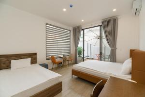 Postel nebo postele na pokoji v ubytování Panda Garden Hotel - Apartment