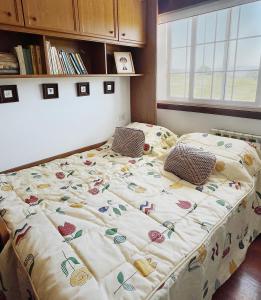 a bed in a bedroom with a blanket on it at Casa María in Santa Eulalia