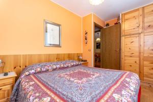 Кровать или кровати в номере La Finestra sul Civetta