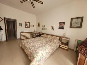 Giường trong phòng chung tại CASA VACANZE TOMMy
