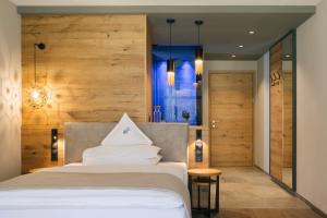 Posteľ alebo postele v izbe v ubytovaní Cyprianerhof Dolomit Resort
