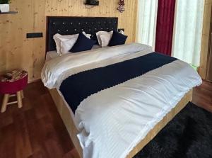 Postel nebo postele na pokoji v ubytování The Woodnest