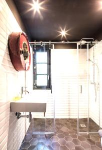 a bathroom with a sink and a shower at Villa Margarita in Palma de Mallorca