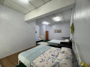 Postel nebo postele na pokoji v ubytování J&J Roomstay