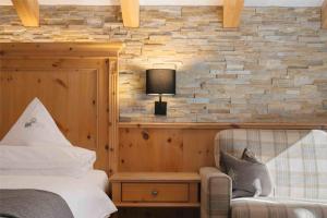 Posteľ alebo postele v izbe v ubytovaní Cyprianerhof Dolomit Resort