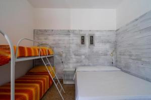 Ένα ή περισσότερα κρεβάτια σε δωμάτιο στο Sul Mare Rita's House