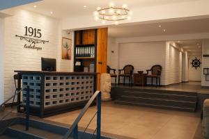 a lobby of a store with a table and chairs at Hotel 1915 Chinatown Kuala Lumpur in Kuala Lumpur