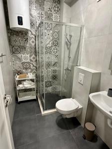 a bathroom with a shower and a toilet and a sink at Casa M- Studio #1 - Brand New in Herceg-Novi