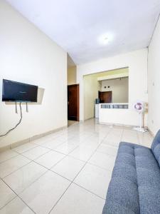 TV a/nebo společenská místnost v ubytování Pesona Banguntapan Homestay Jogja