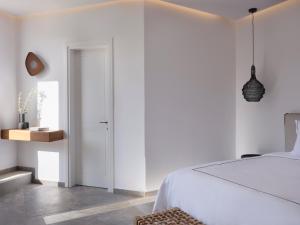Cama ou camas em um quarto em Kalea Mykonos
