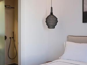Cama ou camas em um quarto em Kalea Mykonos