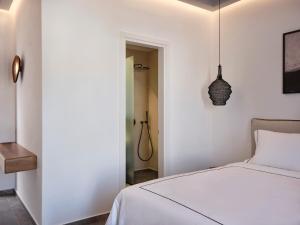 Cama ou camas em um quarto em Kalea Mykonos