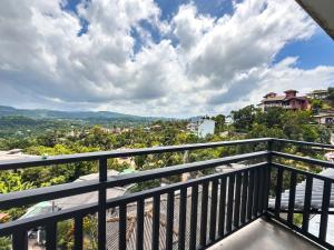 a balcony with a view of a city at Red Chillies Nature Inn in Kandy