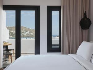 Cama ou camas em um quarto em Kalea Mykonos