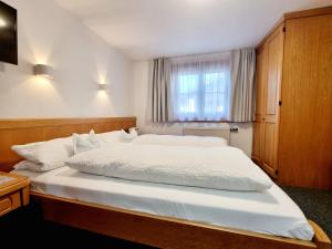Postel nebo postele na pokoji v ubytování Bergfried