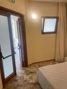 Postel nebo postele na pokoji v ubytování Bellavista Rooms