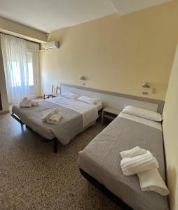 Postel nebo postele na pokoji v ubytování Hotel Ines + 37 fotografií