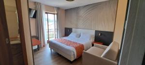 Postel nebo postele na pokoji v ubytování Hotel B&B Fortuna