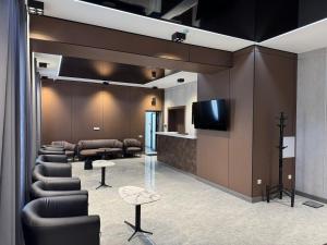 TV a/nebo společenská místnost v ubytování Art City Apartments & Hotel