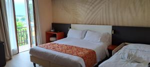Postel nebo postele na pokoji v ubytování Hotel B&B Fortuna