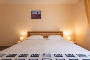 Postel nebo postele na pokoji v ubytování Apartments Kulji