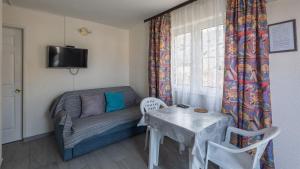 TV a/nebo společenská místnost v ubytování Apartments Kulji