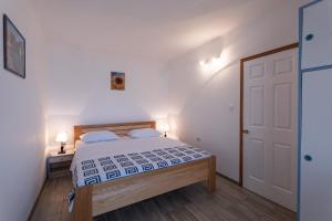 Postel nebo postele na pokoji v ubytování Apartments Kulji