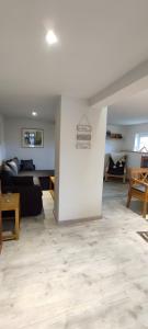 a living room with a couch and a table at Ferienwohnung Am Dächsberg in Plauen