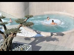 a group of people in a swimming pool at Havre de Thairé in Thairé