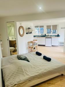 a bedroom with a large bed with two pillows on it at Anglet Chiberta - Proche plage -Terrasse in Anglet