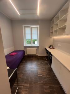a room with a bed and a window at Dom Studencki Hanka in Poznań +26 photos