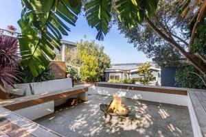 a fire pit in the backyard of a house at The Peak of Mt Martha Spa and Sunset Views in Mount Martha