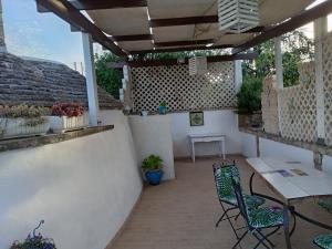 Balkón nebo terasa v ubytování Trullo carrubo + 3 fotografie