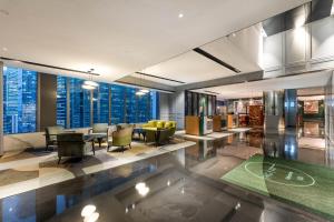 a lobby with a view of the city at Holiday Inn Guangzhou Zhujiang New Town in Guangzhou +163 photos