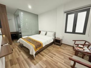 Postel nebo postele na pokoji v ubytování MBee Hotel