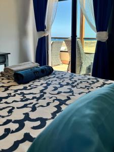 a bedroom with a bed with a view of the ocean at Casa Lily in Antigua +43 photos