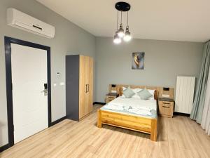 a bedroom with a bed and a door to a room at Taksim alkan tower residence in Istanbul +40 photos