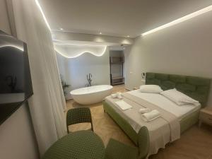 Postel nebo postele na pokoji v ubytování Hotel Parid
