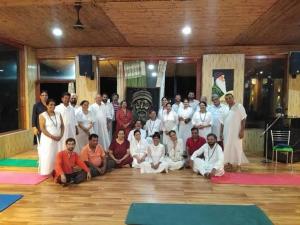 a group of people posing for a picture in a room at Okho Resort Kalka Panchkula in Kālka