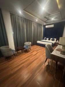 Hotel ML Pride客房内的一张或多张床位