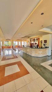 a large room with a lobby with a bar at Philoxenia in Kavála