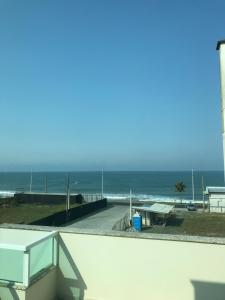 a view of the ocean from the balcony of a condo at Pousada Souza & Souza in Barra Velha