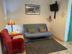 Televízia a/alebo spoločenská miestnosť v ubytovaní Caio Asinio Apartment