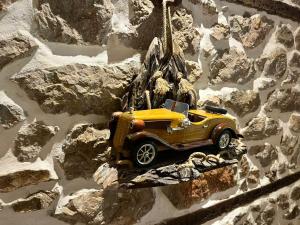 a toy yellow truck hanging from a rope at Vechia Villa Mitllari in Tushemisht +7 photos