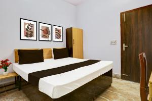 Postel nebo postele na pokoji v ubytování Hotel O HOTEL SHYAM RESIDENCY