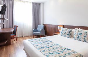 Postel nebo postele na pokoji v ubytování Hotel Olympia Universidades