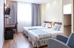 Postel nebo postele na pokoji v ubytování Hotel Olympia Universidades