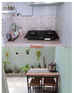 eine Küche mit Herd und einem Tisch mit einigen Pflanzen in der Unterkunft Villa kayana E8 Batu in Karangploso