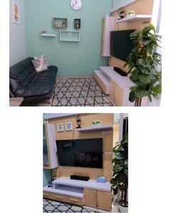 ein Wohnzimmer mit Sofa und Fernseher in der Unterkunft Villa kayana E8 Batu in Karangploso