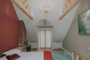 Ένα ή περισσότερα κρεβάτια σε δωμάτιο στο The Lovelace Residence by Threads of Time Hotel Bruges